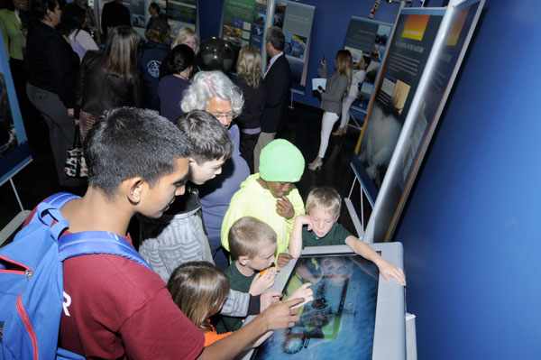 photo of children gathered around an exhibit